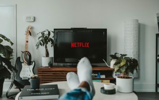 goodencenter-7-Tips-for-Enhancing-Your-Mental-Health-in-College-During-Covid-19--photo-of-young-man-watching-netflix