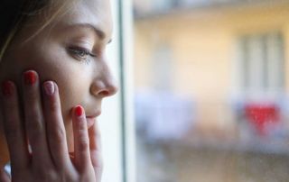 goodencenter-ten-Ways-to-Track-Your-Mental-Health-photo-of-young-girl-next-to-window-glass