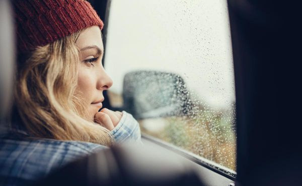 goodencenter-How-to-Make-Good-New-Year’s-Resolutions-for-My-Mental-Health--photo-of-Thoughtful-female-travelling-by-a-car