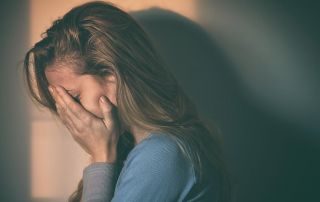 goodencenter-Signs-of-Disconnection-in-Depression-and-Tips-to-Reconnect-photo-of-a-woman-sitting-alone-and-depressed